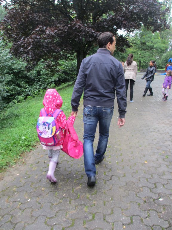 Walking with Papa from daycare to the school
